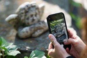 Photographing a statue on a nature walk